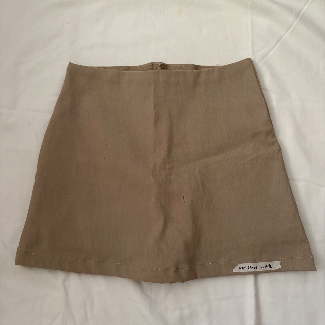 Plain Brown Mini Skirt (Category: Skirts) located in Calabanga. Submitted by vrncashane (Listing ID 1468858792, Image 1). Description: - Color: Neutral earth tone brown - Style: Simple A-line mini skirt - Waist: Fits 24 to 28 inches (stretch waistband) - Length: 13.5 inches - Fit: Easy slip-on style - Versatility: Goes with lots of tops.