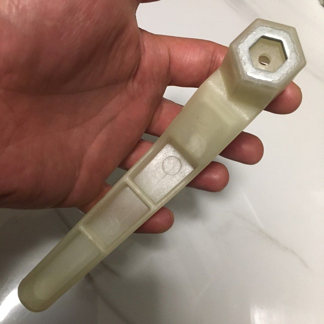 Plastic Faucet Basin Sink Installation Wrench (Category: Bathroom & Kitchen Fixtures) located in Pasay City. Submitted by gilbertso62551 (Listing ID 1468778694, Image 2). Description: - Tool type: White plastic basin wrench - Design: Angled handle with ribbed grip for better hold - Head: Hexagonal socket with center hole - Use: Perfect for under-sink plumbing installations - Condition: Solid construction with minor light marks from storage - As i