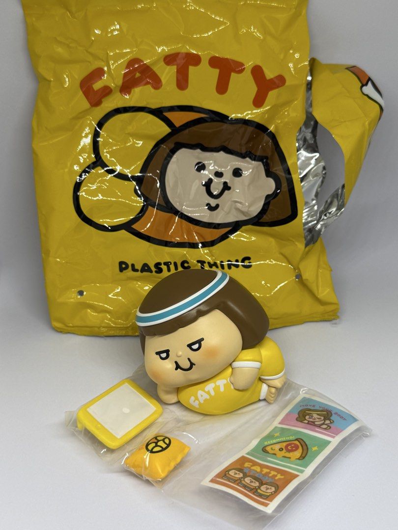Plastic Thing Fatty Collectible Figure Blind Box Set (Category: Designer & Blind Box Toys) located in Las Pinas. Submitted by silverfalcon_dbc769 (Listing ID 1468777049, Image 1). Description: - Character: Plastic Thing Fatty (Yellow theme) - Condition: Opened for photos only, all small parts still factory-sealed in plastic wrappers - Inclusions: Tiny phone, little pillow, stickers, and original foil packaging bag - Perfect for collectors and fan