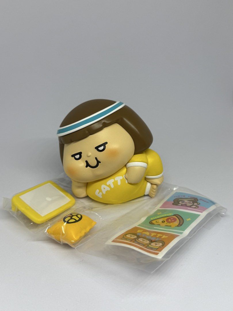 Plastic Thing Fatty Collectible Figure Blind Box Set (Category: Designer & Blind Box Toys) located in Las Pinas. Submitted by silverfalcon_dbc769 (Listing ID 1468777049, Image 3). Description: - Character: Plastic Thing Fatty (Yellow theme) - Condition: Opened for photos only, all small parts still factory-sealed in plastic wrappers - Inclusions: Tiny phone, little pillow, stickers, and original foil packaging bag - Perfect for collectors and fan