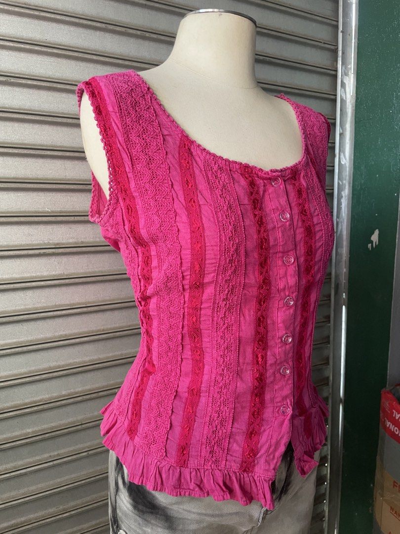 Platinum Pink Sleeveless Lace Trim Button Down Top (Category: Sleeveless) located in Davao. Submitted by riab_qt (Listing ID 1468776413, Image 3). Description: Bright pink sleeveless top from Platinum. Scoop neckline with a front button placket. Detailed with vertical panels of patterned lace running down the front and shoulders. Flounced ruffled hem at the waist. Fitted silhouette. Brand tag clearly visible on the inside collar. Great piece for 
