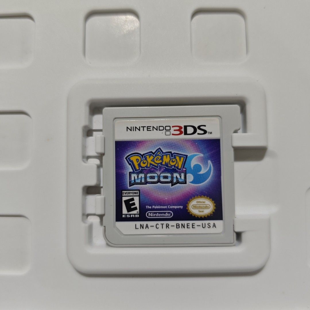 Pokemon Moon 3DS US (Category: Nintendo) located in Quezon City. Submitted by shopme_gadget30 (Listing ID 1468883908, Image 2). Description: kindly read the details first for sale fixed price mint Condition tested and working with Case, game csrt and manual compatible to Nintendo 3DS/2DS usa region qc area meet up: sm north shipping fee must shoulder by the buyer via lalamove or grab payment: bdo/gcash happy gaming everyone.