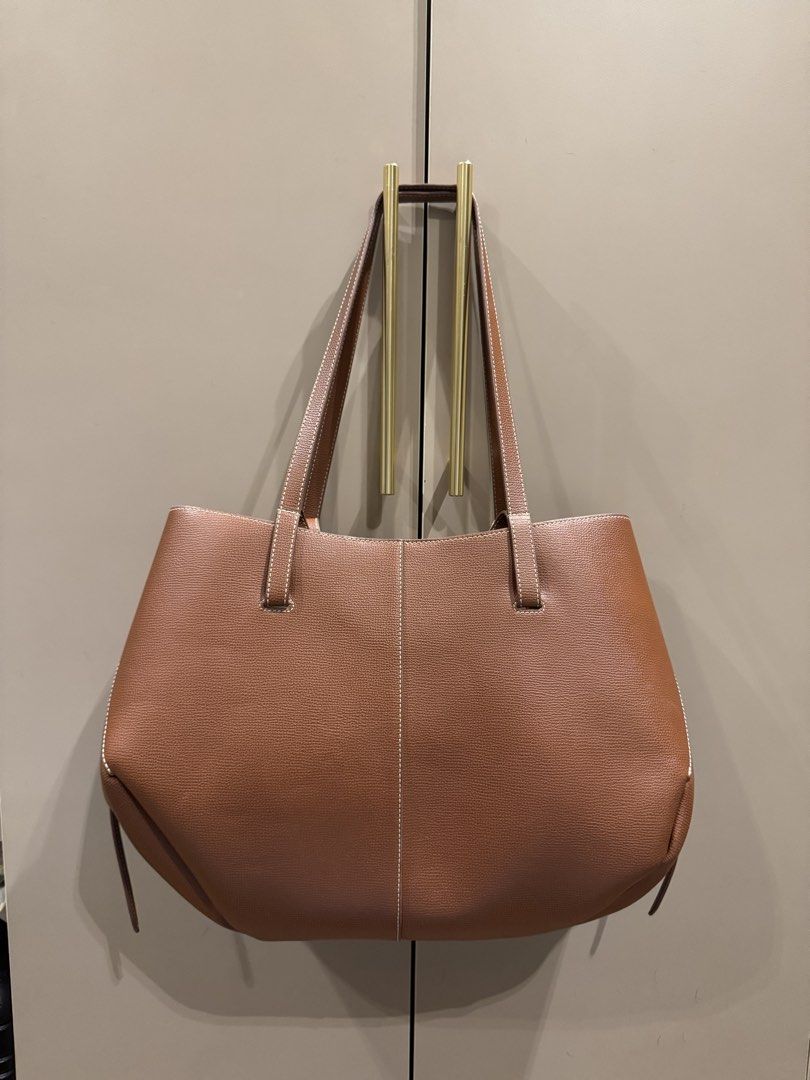 Polene Cyme Regular Cognac (Category: Luxury Bags & Wallets) located in Mandaluyong City. Submitted by bye.buy.bye (Listing ID 1468851812, Image 2). Description: Polene Cyme - regular size - cognac color - with free bag organizer - with box.