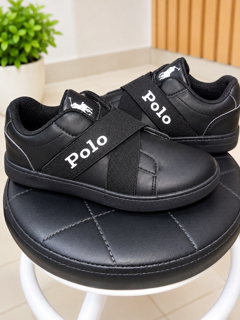 Polo Black Casual Sneakers with Elastic Straps (Category: Babies & Kids Fashion) located in Manila. Submitted by bbprelove1990 (Listing ID 1468853397, Image 1). Description: -Good as New -Kids Size 2 USA, 1 1/2 UK, EUR 32.5 - Unisex -Elegant to wear -Price is Negotiable - Shipping via Lalamove or Grab express Polo Ralph Lauren Oakview Slip On style sneakers, which typically retail between ₱3,500 and ₱5,500 PHP in the Philippines. Because this par