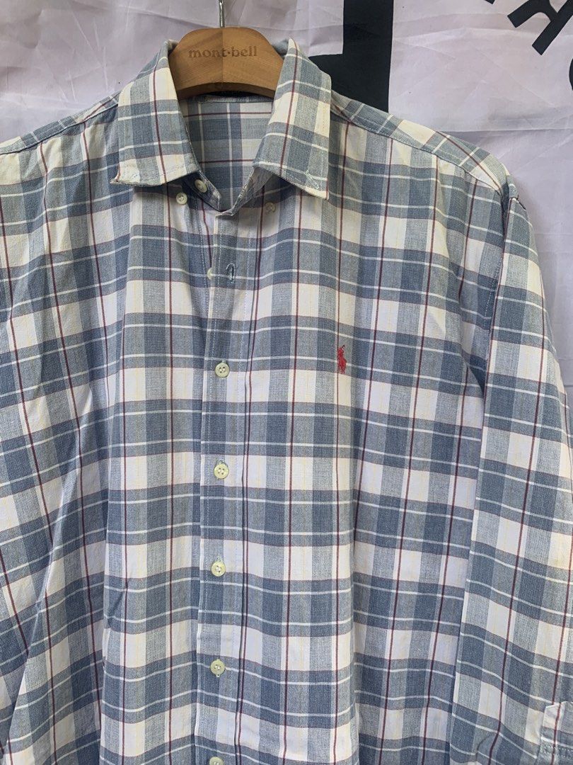 Polo by Ralph Lauren Plaid Polo Button-Down (Category: Tshirts & Polo Shirts ) located in Angeles City. Submitted by kj772c_ (Listing ID 1468739411, Image 2). Description: - Brand: Polo by Ralph Lauren - Style: Long sleeve button-down shirt with classic collar - Design: Blue, white, and red plaid pattern with yellow accent lines - Details: Iconic red embroidered pony logo on the chest - Size: Tagged size 20 - Condition: Great classic casual piece