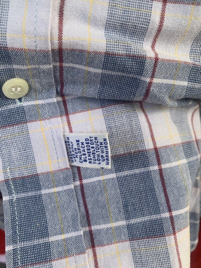 Polo by Ralph Lauren Plaid Polo Button-Down (Category: Tshirts & Polo Shirts ) located in Angeles City. Submitted by kj772c_ (Listing ID 1468739411, Image 3). Description: - Brand: Polo by Ralph Lauren - Style: Long sleeve button-down shirt with classic collar - Design: Blue, white, and red plaid pattern with yellow accent lines - Details: Iconic red embroidered pony logo on the chest - Size: Tagged size 20 - Condition: Great classic casual piece