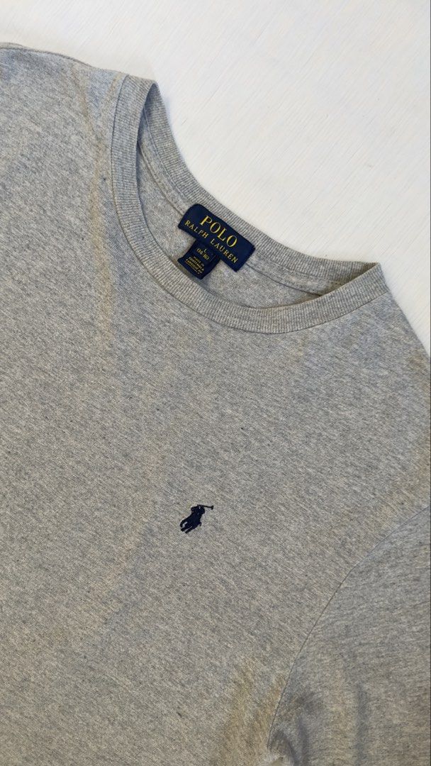 POLO RALPH LAUREN (Category: Tshirts & Polo Shirts ) located in Davao. Submitted by kelsocool (Listing ID 1468801600, Image 2). Description: Polo Ralph Lauren Grey Crewneck Tee Size: L Dimes (inch): 26 - length 18.5 - width 8.2 - sleeve color rate: 9/10 good condition issue - none Description: Minimalist Polo Ralph Lauren heather grey crewneck tee featuring subtle dark navy pony chest embroidery..