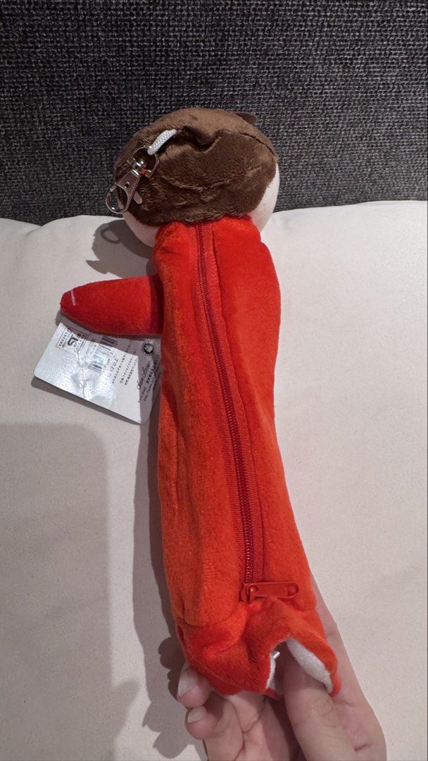 Ponyo Sosuke Plush Pencil Case (Category: Plushies & Soft Toys) located in Mandaluyong City. Submitted by maelovestoshop (Listing ID 1468870122, Image 3). Description: - Official Studio Ghibli Ponyo merchandise featuring Sosuke - Soft red and white plush material with detailed facial embroidery and brown hair - Secure zipper closure running down the back - Equipped with an attached metal keyring clip for easy bag attachment - Comes with the origi