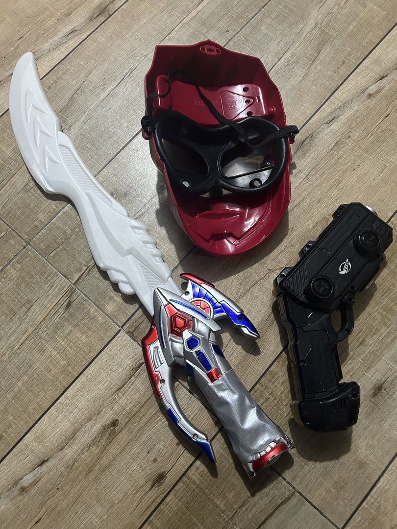 Power Rangers Mask Sword and Blaster Toy Set (Category: Action & Battle Toys) located in Paranaque City. Submitted by zac.sei (Listing ID 1468807122, Image 2). Description: as is condition not tested if light sound working - Red Ranger mask equipped with a secure elastic strap - White and silver toy sword featuring a detailed hilt - Gold and black morpher gun toy complete with keypad buttons and GB logo - Ideal set for kids' dress-up, parties, an