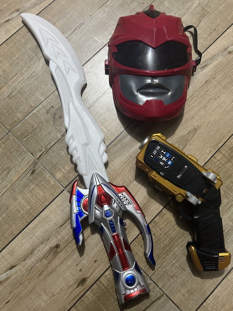 Power Rangers Mask Sword and Blaster Toy Set (Category: Action & Battle Toys) located in Paranaque City. Submitted by zac.sei (Listing ID 1468807122, Image 1). Description: as is condition not tested if light sound working - Red Ranger mask equipped with a secure elastic strap - White and silver toy sword featuring a detailed hilt - Gold and black morpher gun toy complete with keypad buttons and GB logo - Ideal set for kids' dress-up, parties, an