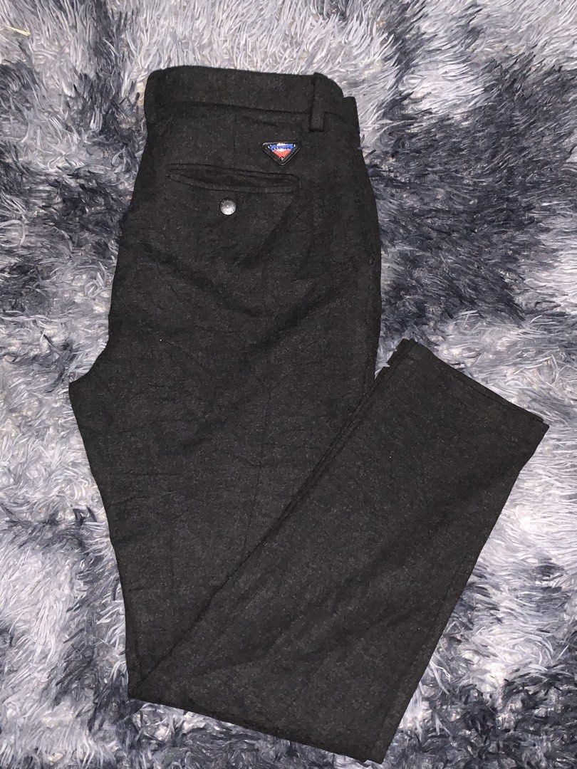 Prada Black Wool-Blend Tailored Trousers (Category: Trousers) located in Tayug. Submitted by cvcthrift (Listing ID 1468919834, Image 1). Description: W-33-34 L-39 NO ISSUE EXCELLENT CR-9.5/10 - Brand: Prada - Color: Dark grey - Material: Premium wool-blend - Fit: Slim cut leg with structured tailoring - Details: Front button closure with Prada branding, back welt pockets with button closure - Branding: Iconic small triangular logo plaque on back 