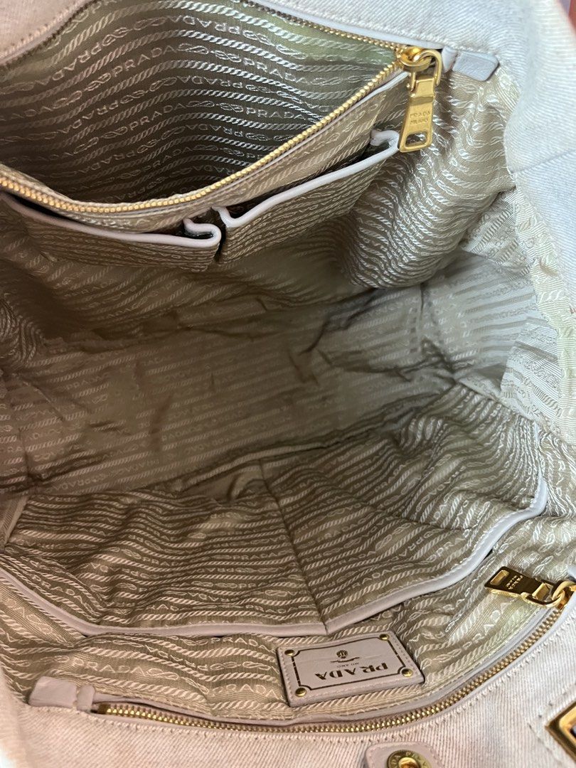 Prada Canapa 2 way bag (Category: Tote Bags) located in Quezon City. Submitted by theideal (Listing ID 1468888968, Image 3). Description: Read first before buy Legit/Authentic Prada canapa 2 way bag No box Still in good and presentable condition No major flaws Minor sign of use only See picture details posted.