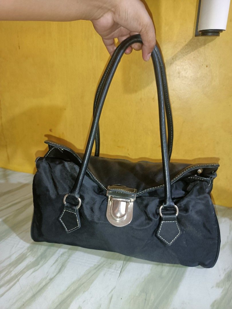 Prada Fold-over Shoulder Bag (Category: Shoulder Bags) located in Bolinao. Submitted by shayne_0215 (Listing ID 1468930153, Image 1). Description: - No Code and No Underzip, just Name Plate and hologram inside - No Flaws - Last Price Posted - Deal Now, Pay Now - MOP: GCASH - SF will be shouldered by the buyer.