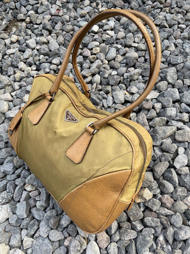 PRADA Handbag Cadena Key Camel Solid Nylon Leather Italy (Category: Luxury Bags & Wallets) located in Davao. Submitted by lwky_thrift (Listing ID 1468817188, Image 2). Description: PRADA Handbag Cadena Key Camel Solid Nylon Leather Italy Authentic Rank AB Good Condition .