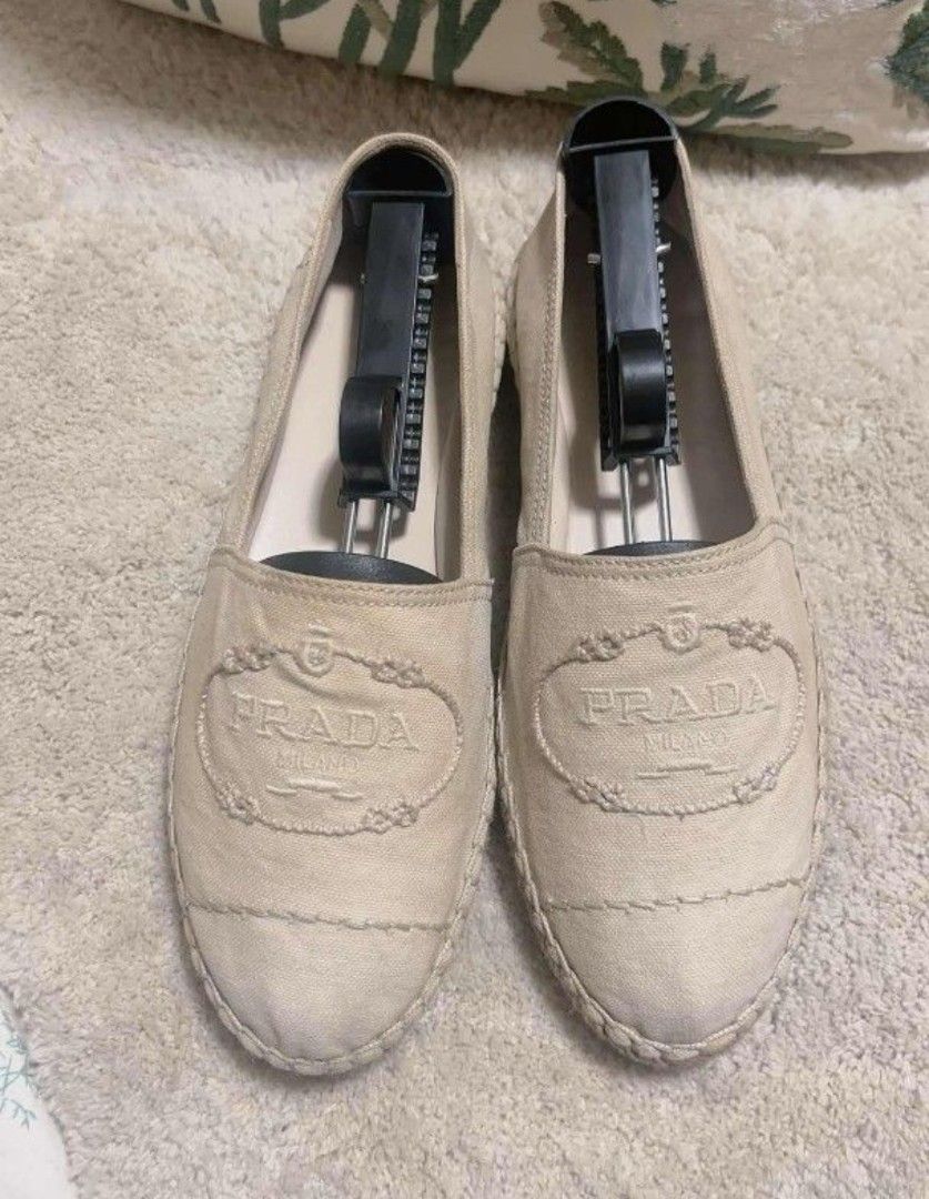 Prada Light beige original espadrille (Category: Flats & Sandals) located in Manila. Submitted by asissaleh35322 (Listing ID 1468885745, Image 3). Description: - Brand: Prada - Style: Canvas Espadrilles Flats - Color: Light Beige - Size: 38 - Details: Embroidered logo on front, classic jute trim along the sole, slip-on design - Condition: Clean inside and out, minimal wear on soles - Inclusions: Shoe trees included - Perfect for: Casual daily wal