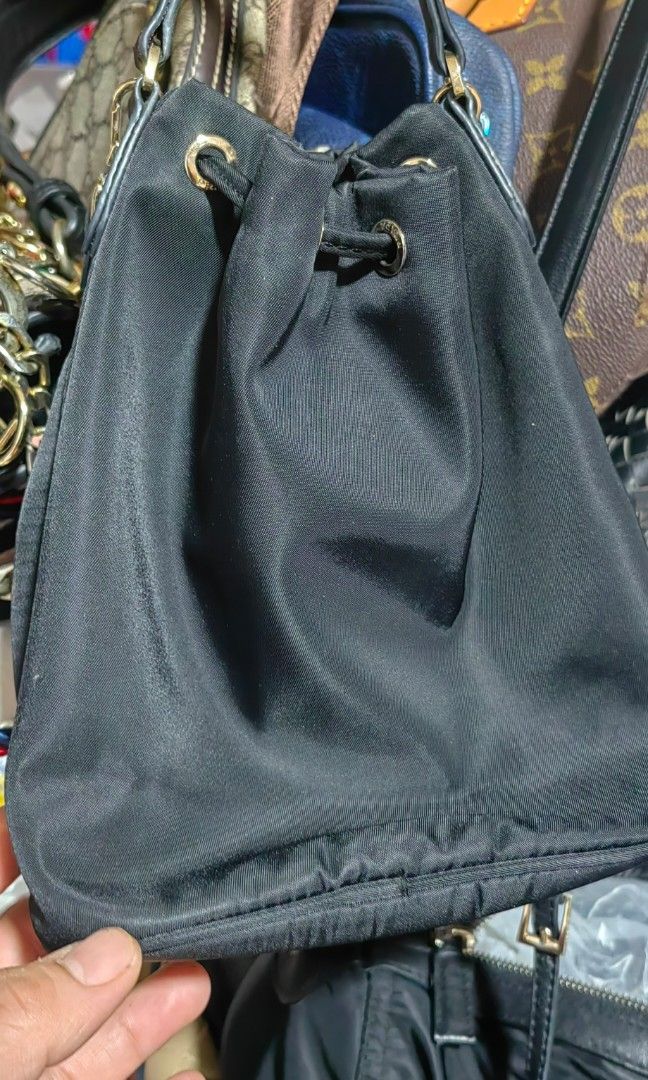prada mini nylon bucket (Category: Cross-body Bags) located in Bacolod City. Submitted by darriebags88 (Listing ID 1468775912, Image 3). Description: riri zip no rubs 2way no code.