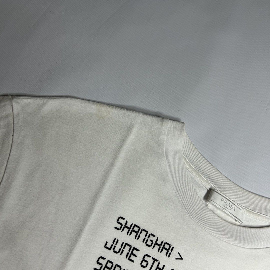 Prada Shanghai Exclusive Shirt (Category: Tshirts & Polo Shirts ) located in Antipolo. Submitted by wvyfrnds (Listing ID 1468743501, Image 3). Description: Prada Shanghai Exclusive Shirt Size: S Color: White Dimensions (Inches): Length: 25.5 Width: 19.5 Color Rate: 9/10 Issues - Light stains 395 PLUS SF.