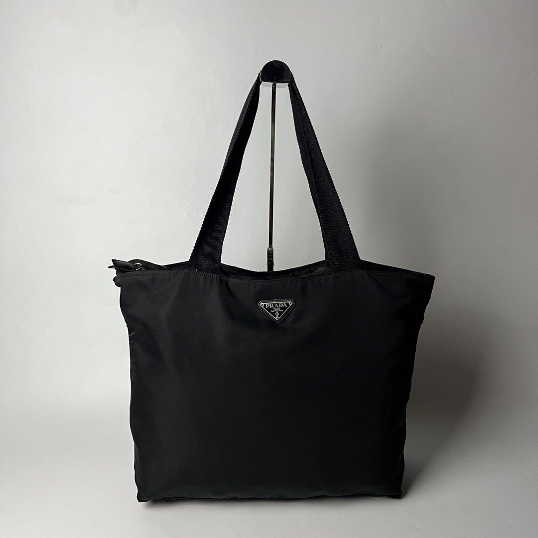Prada Tessuto Black Nylon Tote Bag (Category: Luxury Bags & Wallets) located in Manila. Submitted by streetsavvy (Listing ID 1468805975, Image 1). Description: Prada Tessuto Black Nylon Tote Bag Width: 18” Height: 13” Depth: 4.5” Strap Drop: 10” Measured in Inches Condition: Excellent condition Made in Italy.