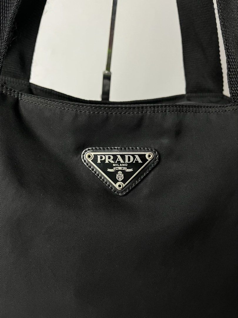Prada Tessuto Black Nylon Tote Bag (Category: Luxury Bags & Wallets) located in Manila. Submitted by streetsavvy (Listing ID 1468805975, Image 3). Description: Prada Tessuto Black Nylon Tote Bag Width: 18” Height: 13” Depth: 4.5” Strap Drop: 10” Measured in Inches Condition: Excellent condition Made in Italy.