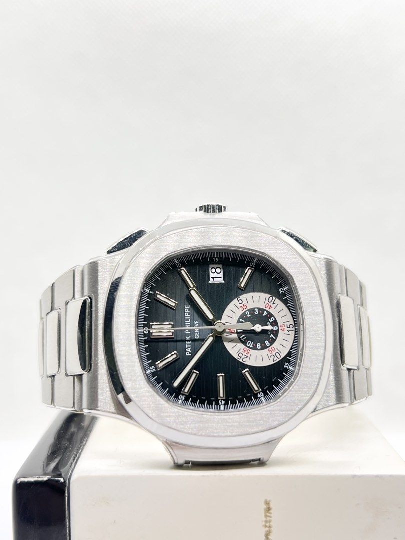 Pre Owned Patek Philippe Nautilus Flyback 5980/1A-001 Blue Dial Automatic Steel Casing Bracelet ( May 13 ) (Category: Watches) located in Singapore. Submitted by brightime (Listing ID 1468814185, Image 1). Description: Pre Owned Patek Philippe Nautilus Flyback 5980/1A-001 Blue Dial Automatic Steel Casing Bracelet ( May 13 ) ** Pre-Owned ** ** Mint Condition With Protective Film ** Model : 5980/1A-001 Also known as : Nautilus Flyback Case size : 4