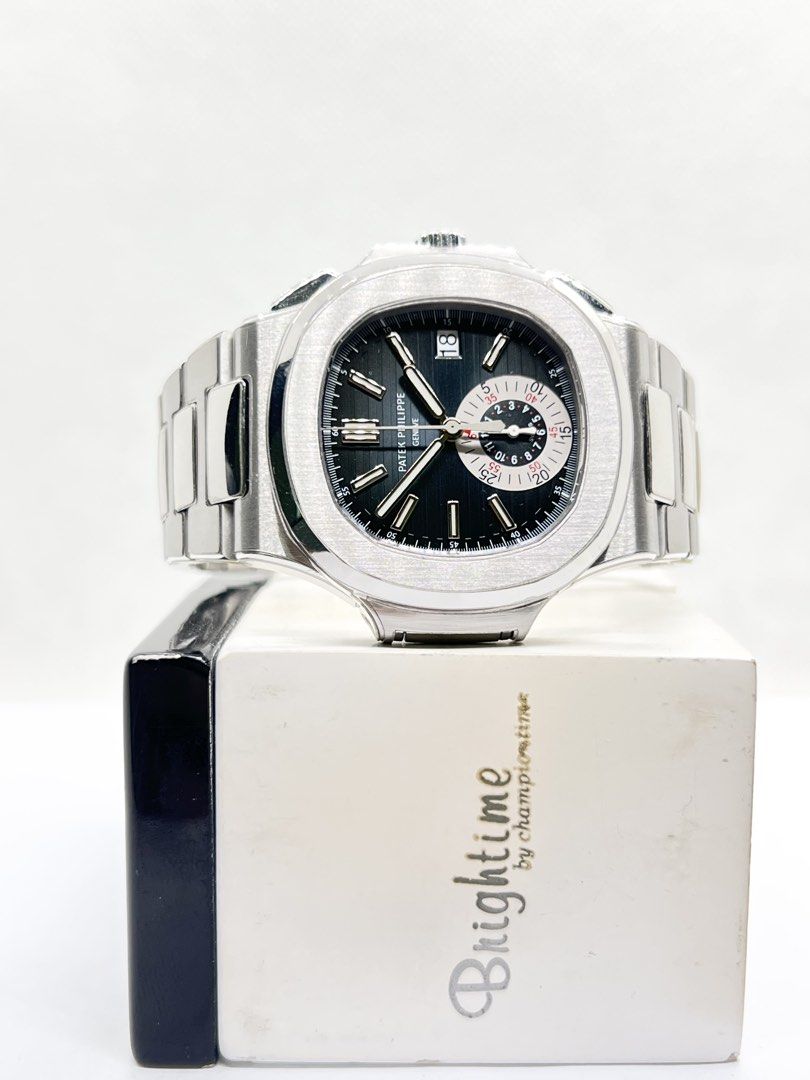 Pre Owned Patek Philippe Nautilus Flyback 5980/1A-001 Blue Dial Automatic Steel Casing Bracelet ( May 13 ) (Category: Watches) located in Singapore. Submitted by brightime (Listing ID 1468814185, Image 2). Description: Pre Owned Patek Philippe Nautilus Flyback 5980/1A-001 Blue Dial Automatic Steel Casing Bracelet ( May 13 ) ** Pre-Owned ** ** Mint Condition With Protective Film ** Model : 5980/1A-001 Also known as : Nautilus Flyback Case size : 4