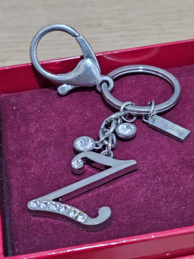 Pre-loved Alfredulla Initial Z Rhinestone Keychain (Category: Other Accessories) located in Caloocan City. Submitted by smart_shoppers_ville (Listing ID 1468713858, Image 3). Description: - Authentic Alfredullq silver-tone keychain featuring letter Z pendant - Adorned with sparkling crystal rhinestones for a touch of elegance - Heavy-duty metal hardware equipped with a secure clasp and split ring - Includes original branded tag stamped Alfredulla