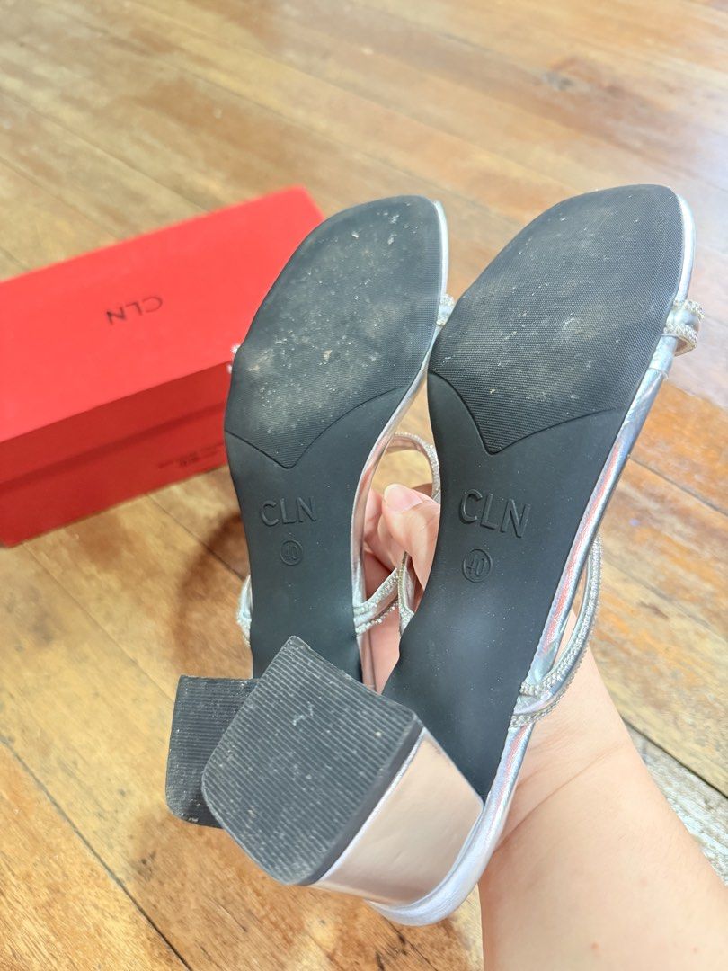 Pre-loved CLN Zhandel (Category: Heels) located in Quezon City. Submitted by celinecabrera (Listing ID 1468754809, Image 3). Description: - Color: Silver - 2.4 inch heels - Size: 40 - Sparkly double strap - Used once last August - Comes with original red shoebox.