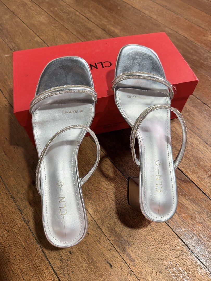Pre-loved CLN Zhandel (Category: Heels) located in Quezon City. Submitted by celinecabrera (Listing ID 1468754809, Image 2). Description: - Color: Silver - 2.4 inch heels - Size: 40 - Sparkly double strap - Used once last August - Comes with original red shoebox.