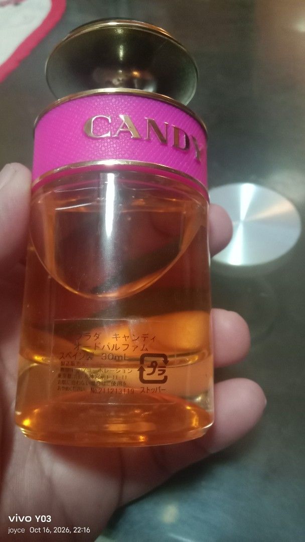 Preloved Prada Candy Eau de Parfum 30ml (Category: Fragrance & Deodorants) located in Cabuyao City. Submitted by selections888 (Listing ID 1468886940, Image 3). Description: - Brand: Prada Candy Eau de Parfum - Size: 30ml (Approx. 80% remaining) - Scent Profile: Deliciously sweet caramel - Packaging Details: Iconic pink leather band with gold lettering, classic dark cap, and golden nozzle - Note: Features Japanese text printed on the back label -