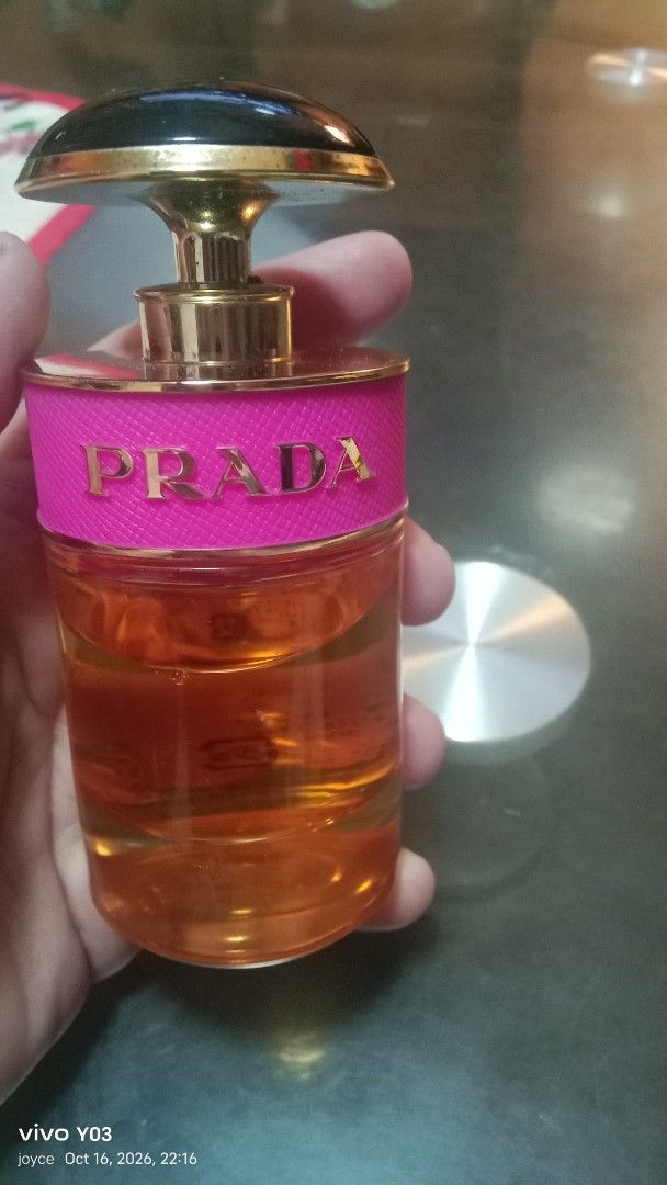 Preloved Prada Candy Eau de Parfum 30ml (Category: Fragrance & Deodorants) located in Cabuyao City. Submitted by selections888 (Listing ID 1468886940, Image 2). Description: - Brand: Prada Candy Eau de Parfum - Size: 30ml (Approx. 80% remaining) - Scent Profile: Deliciously sweet caramel - Packaging Details: Iconic pink leather band with gold lettering, classic dark cap, and golden nozzle - Note: Features Japanese text printed on the back label -