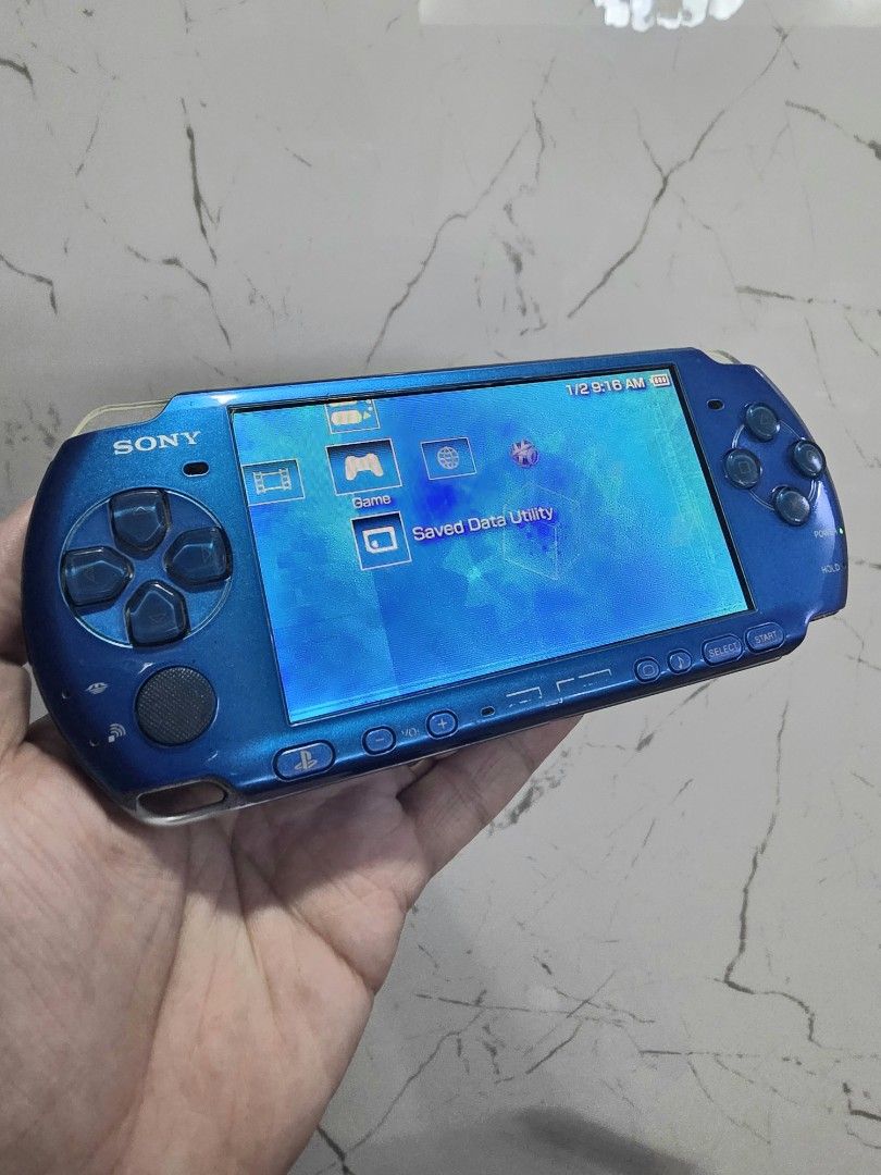 PSP 3000 Slim Vibrant Blue Handheld Console (Category: PlayStation) located in Mandaluyong City. Submitted by chan.ningtatum (Listing ID 1468769928, Image 2). Description: For Sale! PSP 3000 Slim Playstation Portable - Color: Vibrant Blue - Condition: Fully tested, powers on, and works great with normal signs of handling - Features: Functional buttons, analog stick, screen, and secure UMD door - Ideal for: Retro gaming enthusiasts Jailbreak Insta