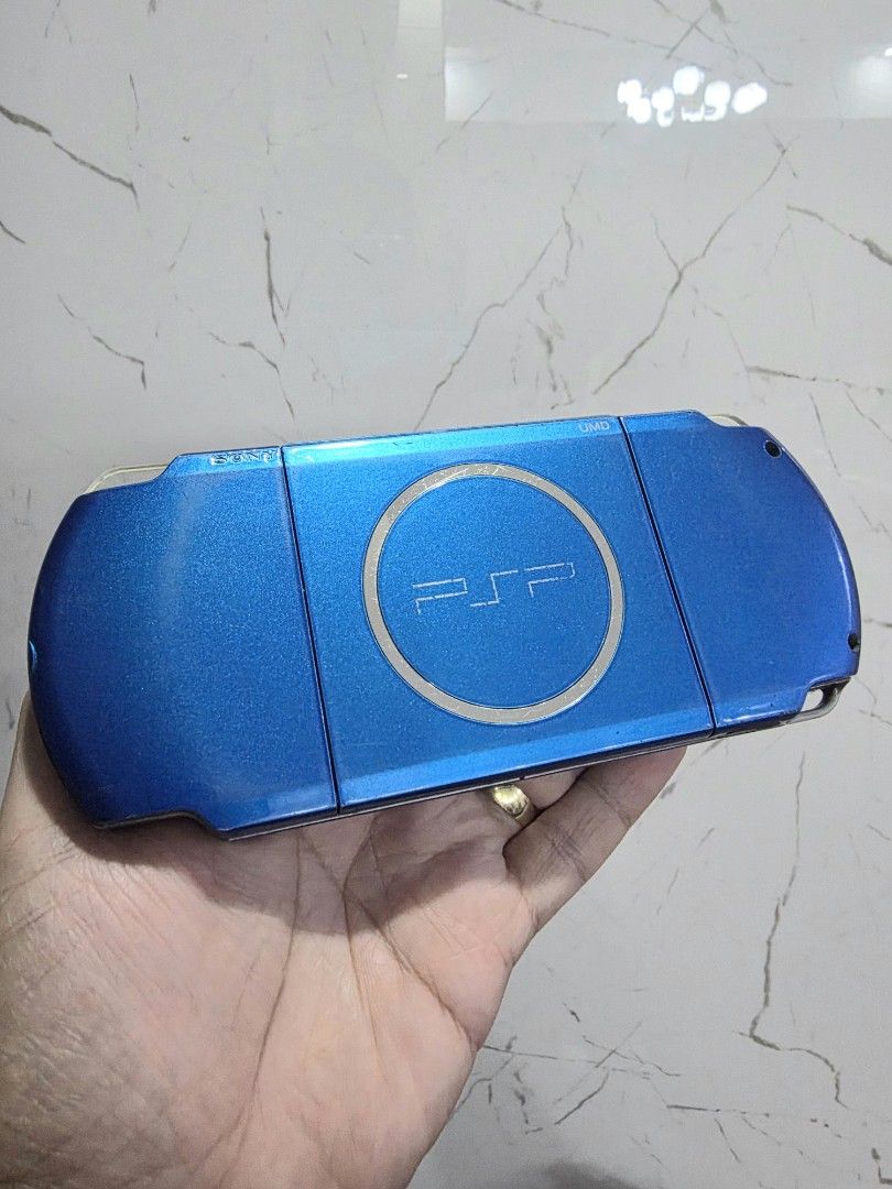 PSP 3000 Slim Vibrant Blue Handheld Console (Category: PlayStation) located in Mandaluyong City. Submitted by chan.ningtatum (Listing ID 1468769928, Image 3). Description: For Sale! PSP 3000 Slim Playstation Portable - Color: Vibrant Blue - Condition: Fully tested, powers on, and works great with normal signs of handling - Features: Functional buttons, analog stick, screen, and secure UMD door - Ideal for: Retro gaming enthusiasts Jailbreak Insta