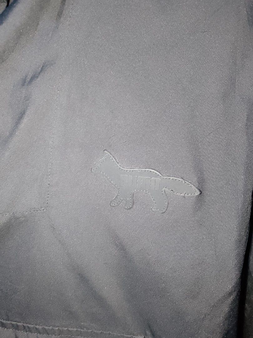 Puma x Maison Kitsune Black Zip Jacket (Category: Coats, Jackets and Outerwear) located in Manila. Submitted by mjthrifted_second (Listing ID 1468734728, Image 3). Description: - Brand: Puma x Maison Kitsuné Collaboration - Color: Classic Black - Size: Medium (US, CA, EU standard) -Dimes: 25/28 - Features: Full zip front with an adjustable hood - Design: Clean minimalist aesthetic with an exclusive co-branded label inside the collar - Condition: 