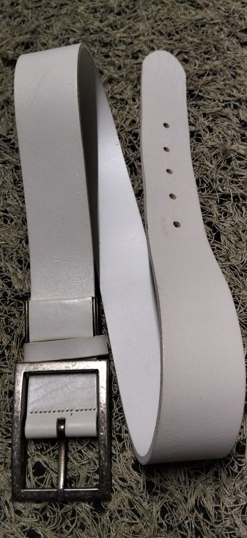 PURE SOLID GUINE IVORY WHITE LEATHER BELT UNISEX with Rectangular Buckle (Category: Activewear) located in Paranaque City. Submitted by michael-08 (Listing ID 1468832650, Image 1). Description: - Color & Material: Clean white leather - Hardware: Sturdy silver-tone chunky rectangular buckle - Fit: Five punched holes for easy adjustment - Style: Versatile everyday accessory - Pairing: Great for casual denim or tailored trousers PURE SOLID GENUINE I