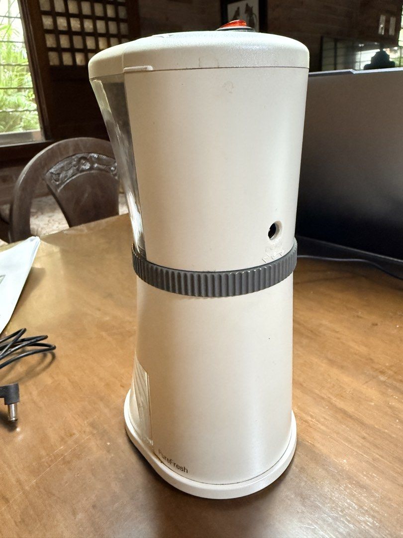 PureFresh Electric Coffee Grinder (Category: Coffee Machines & Makers) located in Quezon City. Submitted by bluginge (Listing ID 1468783723, Image 3). Description: - White - Ceramic conical burr with 17 grind settings - Used to grind whole beans for french press, but I now have an espresso machine set up so I needed another kind of grinder - Includes standard wall adapter and sealed car cigarette lighter adapter cable - Includes instruction manua