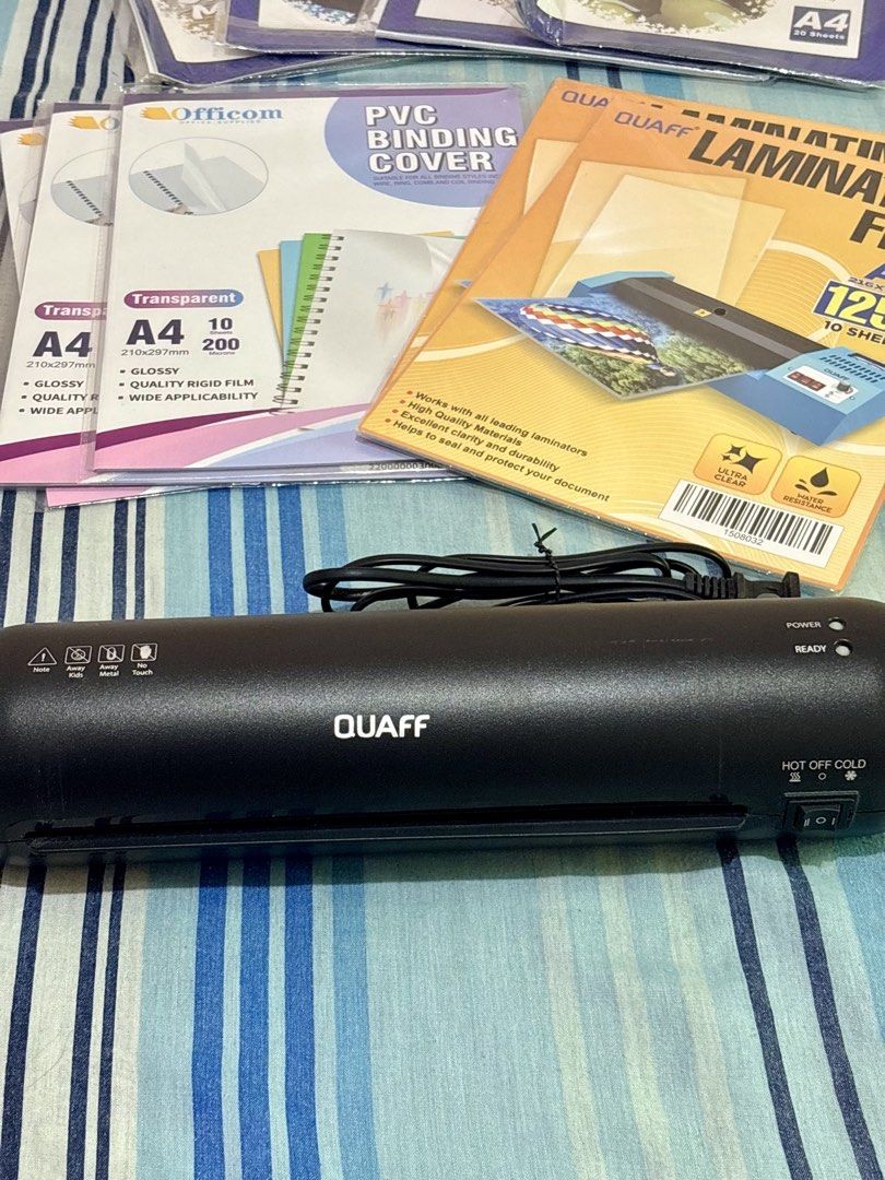 Quaff Laminator Machine with Films, Binding Covers, and Craft Kits (Category: Craft Supplies & Tools) located in Lipa City. Submitted by heyimdg (Listing ID 1468717344, Image 2). Description: LAMINATING & CRAFTS SET with ~850 worth of materials Inclusions: Hot & Cold Laminating Machine A4 Laminating Film 125mic PVC Binding Cover Cold Photo Top - Glossy Cold Photo Top - Glitter Cold Photo Top - Holo Rainbow Cold Photo Top - Canvas Matte Candle #8 