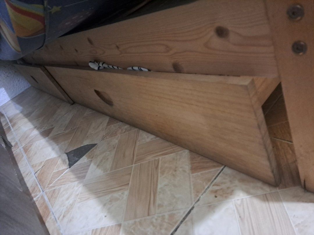 Queen 150CM Bed With Drawers Panda's Home (Category: Bed Frames & Mattresses) located in Pasig City. Submitted by mywellloved (Listing ID 1468107488, Image 3). Description: - Brand: Panda's Home - Size: Fits standard queen mattresses - Material/Finish: Sturdy build with a natural wood finish - Storage: Built-in drawers underneath for extra space-saving - Design: Elegant horizontal pavement design on the headboard - Height: Stands 30cm high from t