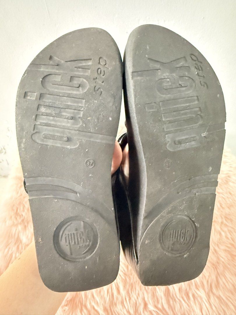 Quick Step Black Crystal Thong Wedge Sandals Size 37 (Category: Flats & Sandals) located in Quezon City. Submitted by shaberbree (Listing ID 1468737302, Image 3). Description: - Brand: Quick Step - Size: 37 - Color: Black - Style: Thong wedge sandals with easy slip-on design - Details: Eye-catching rhinestone embellished circular accents - Sole: Textured with stamped branding for grip - Perfect for warm weather and adding a bit of height.