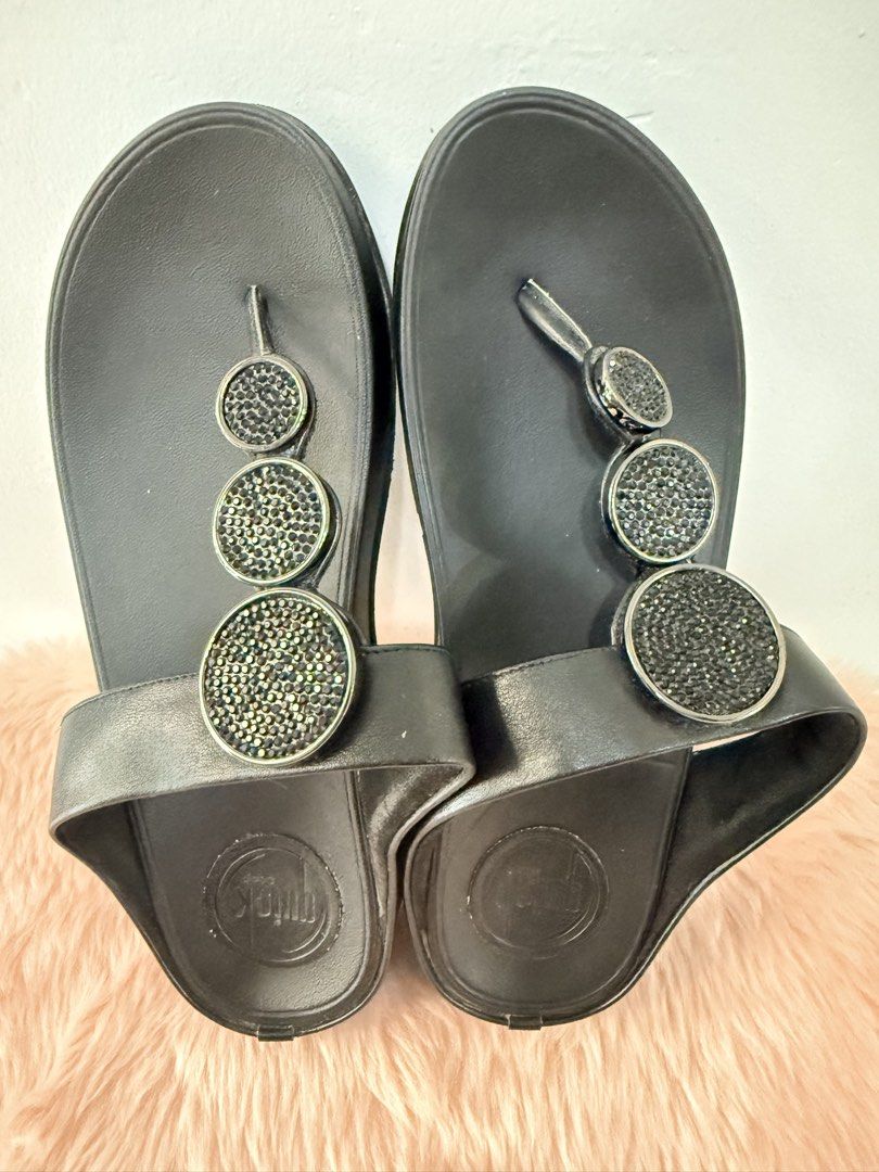 Quick Step Black Crystal Thong Wedge Sandals Size 37 (Category: Flats & Sandals) located in Quezon City. Submitted by shaberbree (Listing ID 1468737302, Image 2). Description: - Brand: Quick Step - Size: 37 - Color: Black - Style: Thong wedge sandals with easy slip-on design - Details: Eye-catching rhinestone embellished circular accents - Sole: Textured with stamped branding for grip - Perfect for warm weather and adding a bit of height.