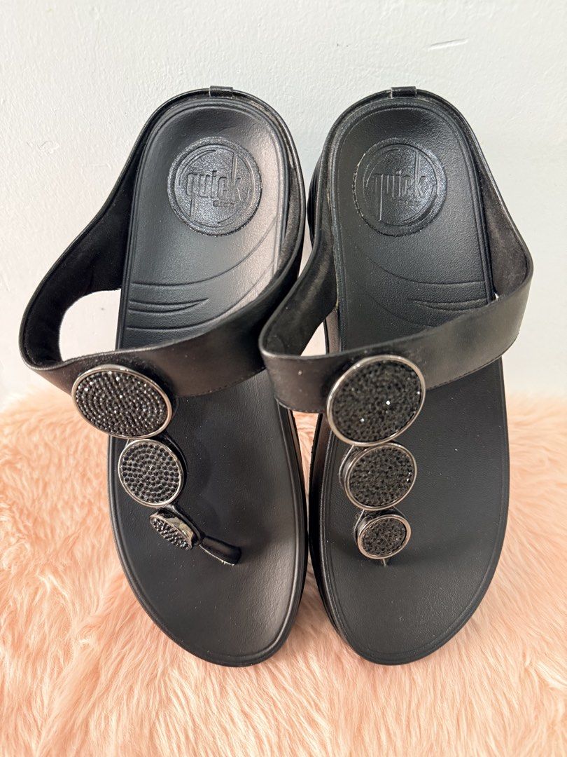 Quick Step Black Crystal Thong Wedge Sandals Size 37 (Category: Flats & Sandals) located in Quezon City. Submitted by shaberbree (Listing ID 1468737302, Image 1). Description: - Brand: Quick Step - Size: 37 - Color: Black - Style: Thong wedge sandals with easy slip-on design - Details: Eye-catching rhinestone embellished circular accents - Sole: Textured with stamped branding for grip - Perfect for warm weather and adding a bit of height.