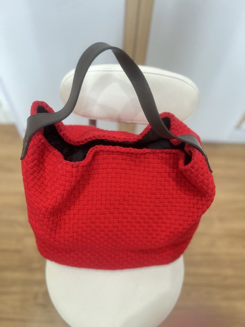 R2R x Aranaz Red Buslo Bag (Category: Shoulder Bags) located in Quezon City. Submitted by ninanicetohave (Listing ID 1468748118, Image 2). Description: - Brand: Aranaz - Color: Bright red buslp woven design with dark brown leather handles and base, weaves are all still intact - Interior: Brown fabric lining with zipper pocket and two open pockets - Closure: Secure magnetic snap closure - Size: Approx. 16 inches across, Handle drop around 8 inches