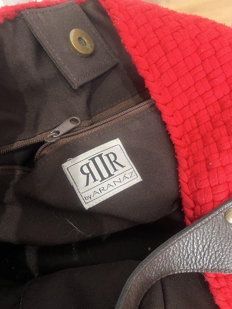 R2R x Aranaz Red Buslo Bag (Category: Shoulder Bags) located in Quezon City. Submitted by ninanicetohave (Listing ID 1468748118, Image 3). Description: - Brand: Aranaz - Color: Bright red buslp woven design with dark brown leather handles and base, weaves are all still intact - Interior: Brown fabric lining with zipper pocket and two open pockets - Closure: Secure magnetic snap closure - Size: Approx. 16 inches across, Handle drop around 8 inches