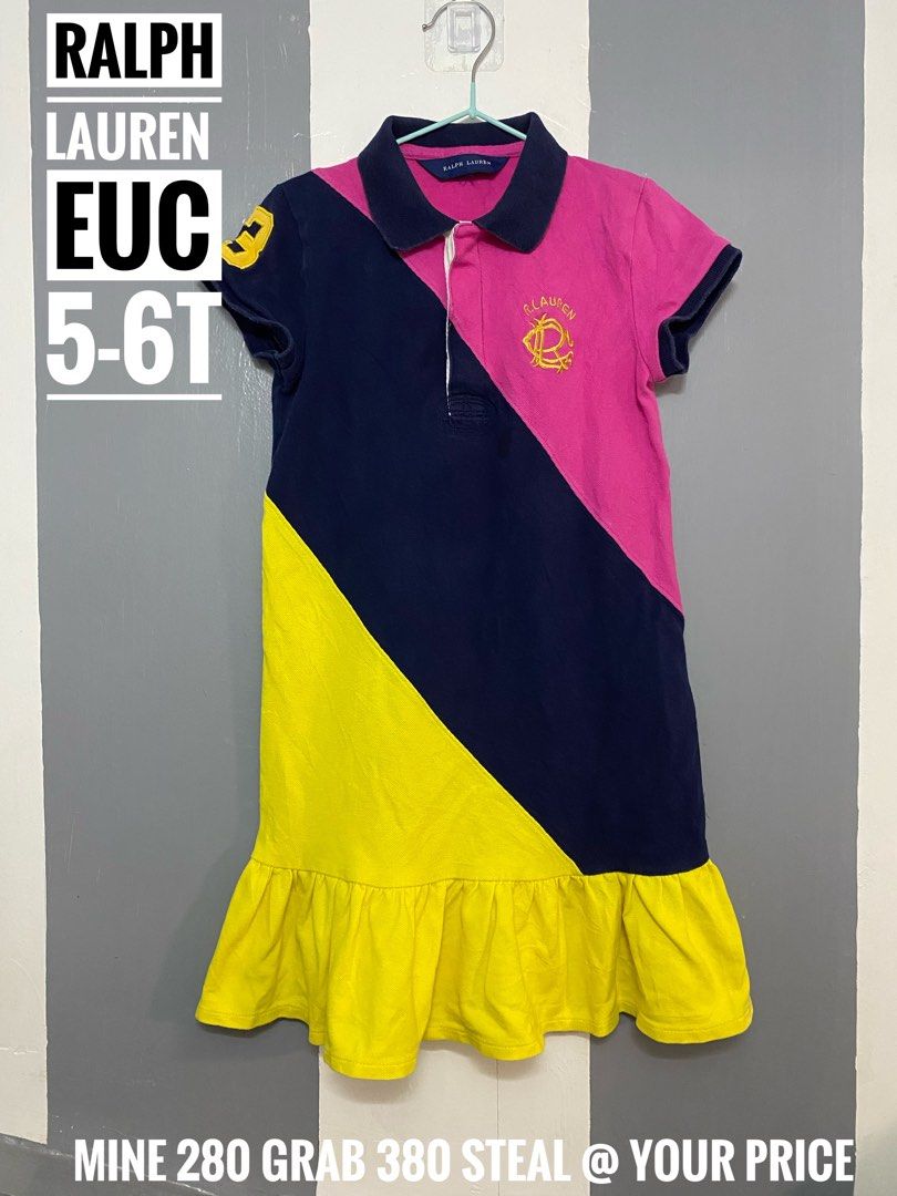 Ralph Lauren Dress (Category: Babies & Kids Fashion) located in Paranaque City. Submitted by shiney10 (Listing ID 1468837170, Image 1). Description: - Brand: Ralph Lauren - Item: Girls Polo Dress - Size: 5-6T - Design: Tricolor panels (Pink, Navy Blue, Yellow) - Details: Navy collar, short sleeves, button placket, and ruffle hem - Accents: Embroidered logo crest on the chest and number '3' on the sleeve - Condition: Excellent pre-loved / Brand ne