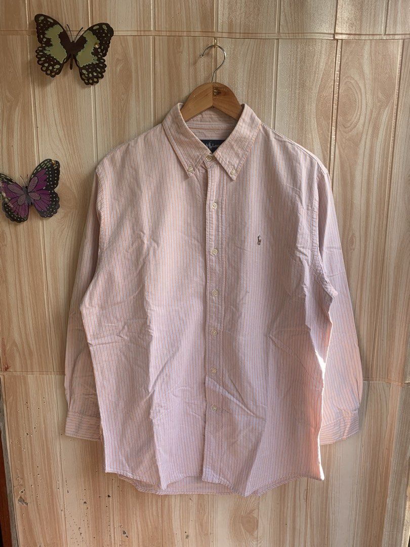 Ralph Lauren Orange Striped Button Down Shirt 16-31 (Category: Tshirts & Polo Shirts ) located in Barobo. Submitted by pammythrift (Listing ID 1468754766, Image 1). Description: - Brand: Ralph Lauren - Design: Orange and white stripes with blue pinstripes - Details: Button-down collar, front button closure, and iconic embroidered pony logo on the chest pocket - Material: 100% lightweight and breathable cotton - Origin: Made in Hong Kong - Size: F