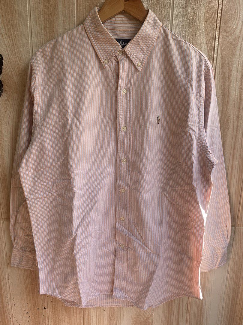 Ralph Lauren Orange Striped Button Down Shirt 16-31 (Category: Tshirts & Polo Shirts ) located in Barobo. Submitted by pammythrift (Listing ID 1468754766, Image 2). Description: - Brand: Ralph Lauren - Design: Orange and white stripes with blue pinstripes - Details: Button-down collar, front button closure, and iconic embroidered pony logo on the chest pocket - Material: 100% lightweight and breathable cotton - Origin: Made in Hong Kong - Size: F