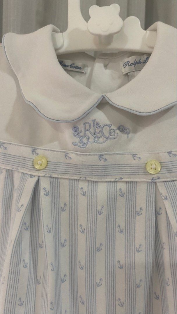 ralph lauren romper (Category: Babies & Kids Fashion) located in Manila. Submitted by louiesalvador (Listing ID 1468716723, Image 2). Description: • brand: ralph lauren • size: 9 months on tag • ultra-soft pima cotton for baby's comfort • white and light blue with vertical stripes and sailor-style collar with blue trim • cute blue anchor prints, embroidered RL & Co logo on the chest, and two small yellow front buttons.