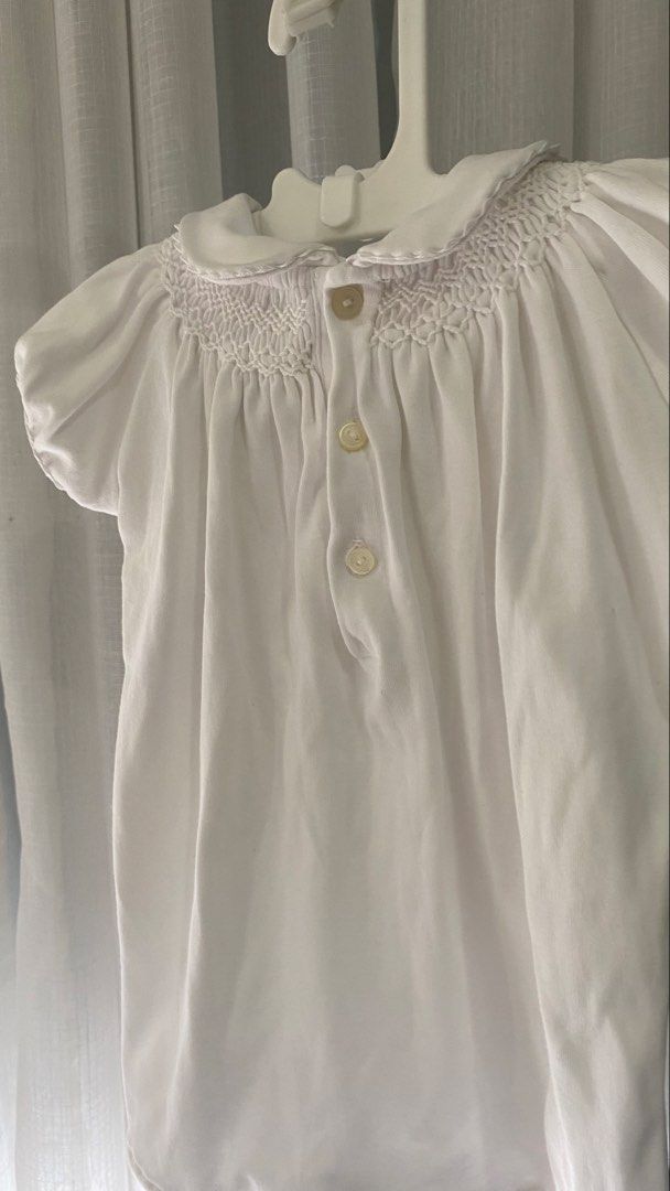 ralph lauren smocked romper (Category: Babies & Kids Fashion) located in Manila. Submitted by louiesalvador (Listing ID 1468716707, Image 3). Description: • brand: ralph lauren • size: 3 months on tag • short puff sleeves with a round collar and delicate embroidery • detailed smocking across the chest for a charming look • button closure at the back for easy dressing • convenient snap buttons at the bottom for quick diaper changes • made with sof