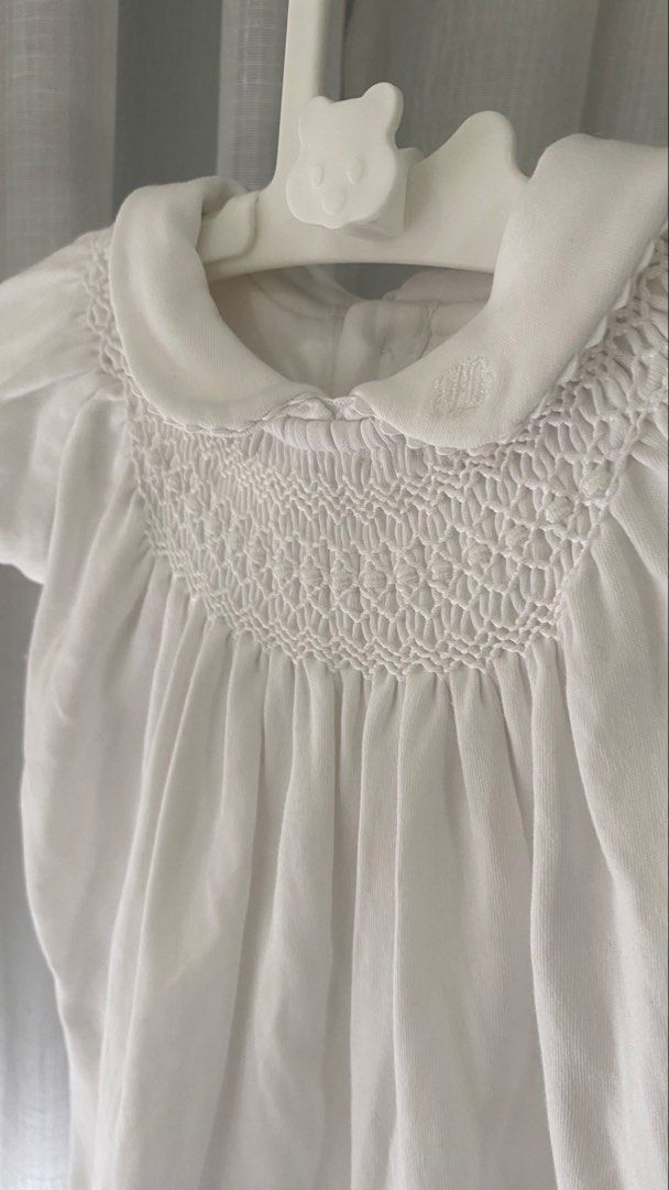 ralph lauren smocked romper (Category: Babies & Kids Fashion) located in Manila. Submitted by louiesalvador (Listing ID 1468716707, Image 2). Description: • brand: ralph lauren • size: 3 months on tag • short puff sleeves with a round collar and delicate embroidery • detailed smocking across the chest for a charming look • button closure at the back for easy dressing • convenient snap buttons at the bottom for quick diaper changes • made with sof