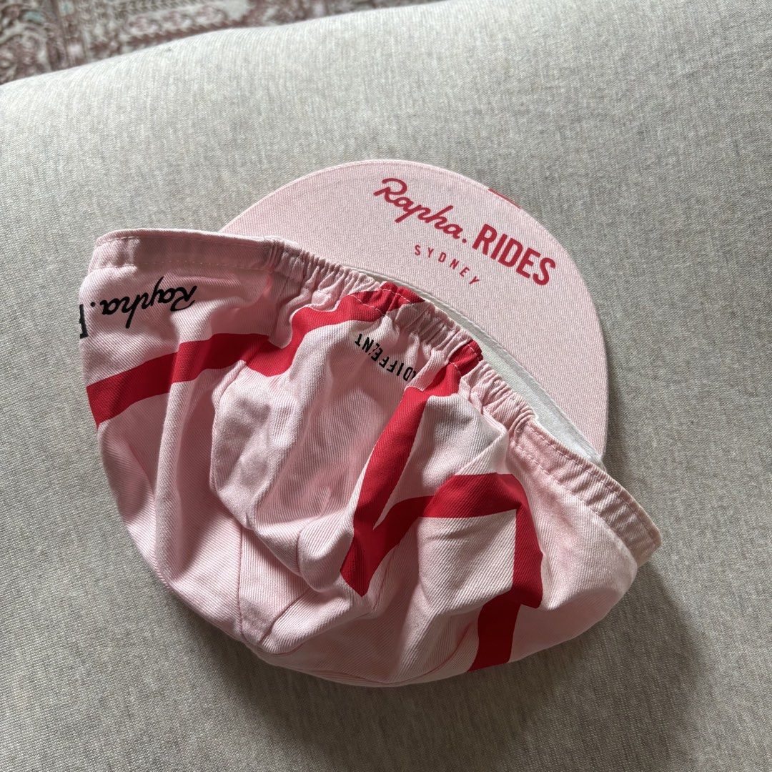Rapha Sydney Cycling Cap - Pink Red (Category: Other Sports Equipment and Supplies) located in Paranaque City. Submitted by ngpa__ (Listing ID 1468762830, Image 3). Description: 💗 Rapha cycling cap in a pink and red design featuring Sydney and Rapha.RIDES logos. Details: * Condition: 9.5/10 - like new * Includes: Cycling cap only 📍 Location: Parañaque / Metro Manila 🚚 Shipping available at buyer’s expense Message me if interested! .