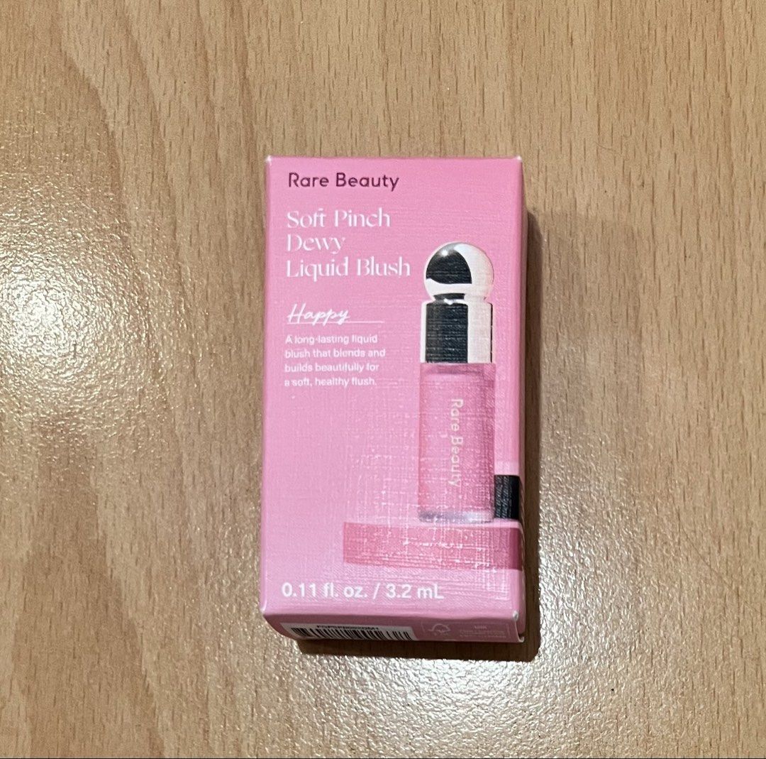 Rare Beauty Liquid Blush in Happy (Category: Makeup) located in Manila. Submitted by piperpenn (Listing ID 1468852997, Image 1). Description: - Product: Rare Beauty Soft Pinch Dewy Liquid Blush - Shade: Happy - Size: Mini size (3.2 ml) - Finish: Dewy with a long-lasting, easily blendable formula - Condition: Brand new, never opened, in original packaging.